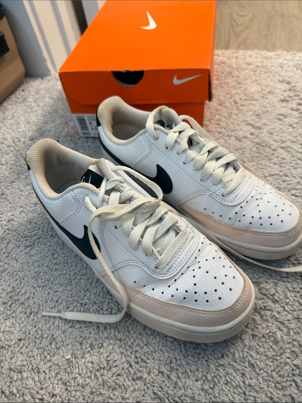 Nike women’s Low-Top Sneakers — White with Black Swoosh and Beige Trim
